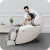 A man and woman sitting in a novita Massage Chair B11.