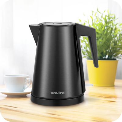 A Clearance Sale - Water Kettle NK6 by novita sitting on a wooden table.