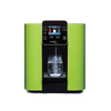 A HydroCube™ Hot/Cold Water Dispenser W29 with 3 Years Warranty from novita with a glass of water.