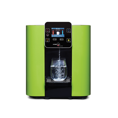 A novita HydroCube™ Hot/Cold Water Dispenser W29 with 3 Years Warranty with a glass of water.