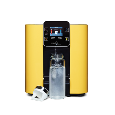 A yellow HydroCube™ Hot/Cold Water Dispenser W29 with 3 Years Warranty by novita with a bottle of water next to it.