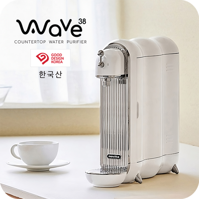 A novita Water Purifier W38 with a cup of coffee next to it.