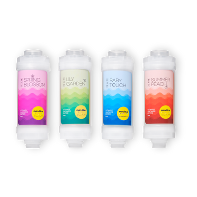 A set of four novita SG Vitamin Shower Filters with different colors.