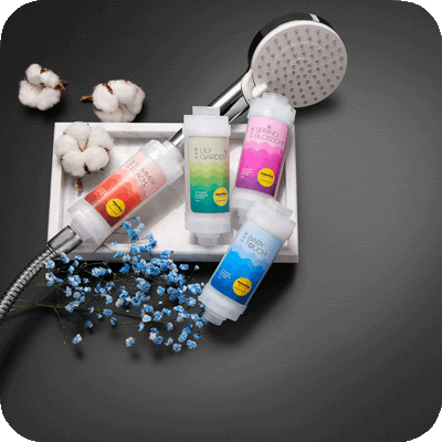 A tray with a Vitamin Shower Filter (4 in 1 Box) by novita SG, soap, and cotton.