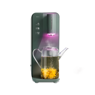 A novita SG Instant Hot Water Dispenser W10 - The Absolute with a cup of tea in it.