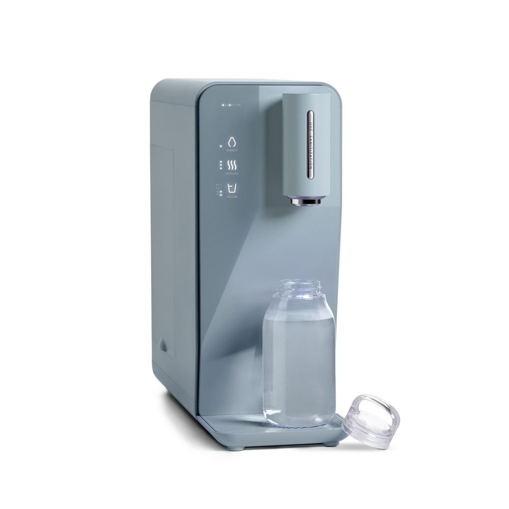 A novita SG Instant Hot Water Dispenser W10 - The Absolute with a bottle of water on it.