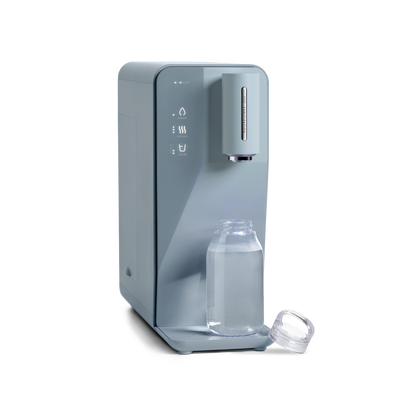 A novita SG Instant Hot Water Dispenser W10 - The Absolute with a bottle of water on it.