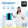 A woman is standing next to a novita HydroCube™ Hot/Cold Water Dispenser W29 with 3 Years Warranty.