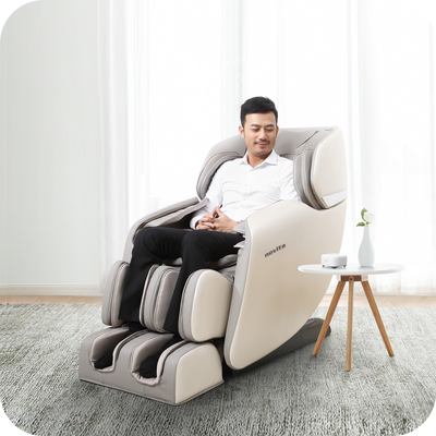 A man sitting in a novita Massage Chair B11.