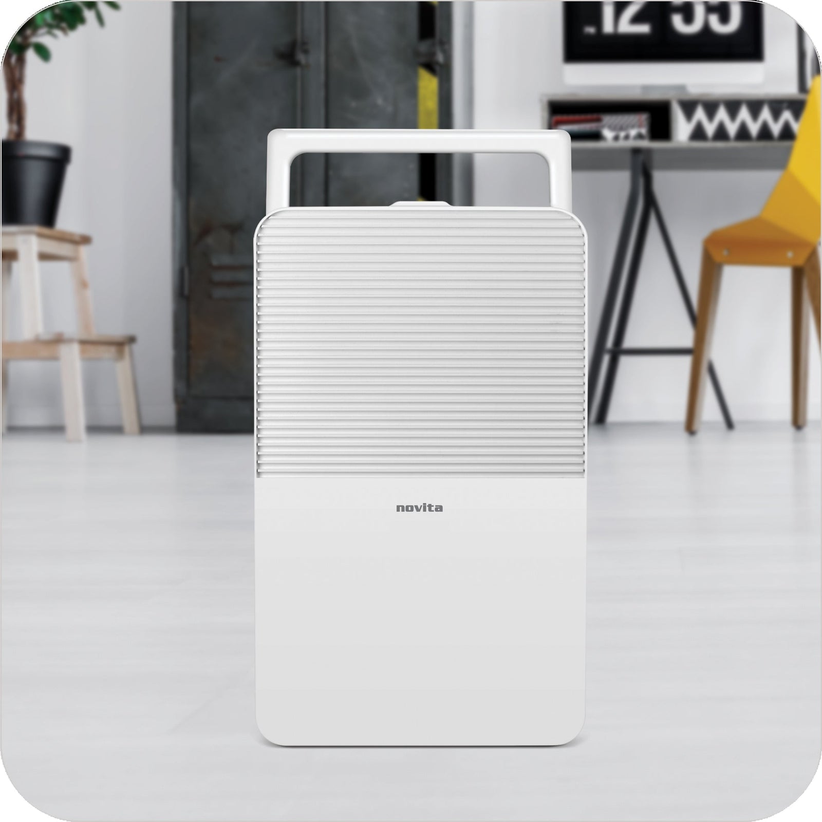 A white novita dehumidifier ND12 in a living room.
