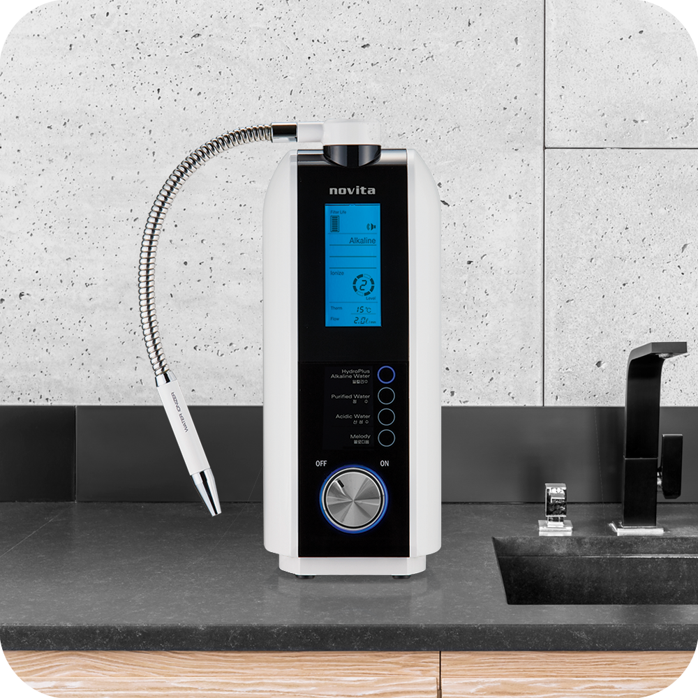 A novita HydroPlus® Premium Water Ionizer NP9960i sitting on top of a counter.