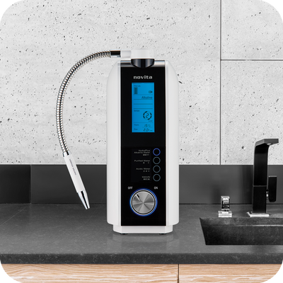 A novita HydroPlus® Premium Water Ionizer NP9960i sitting on top of a counter.