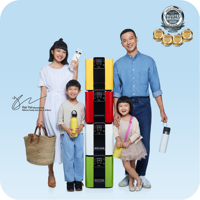 A family is posing for a photo with a novita HydroCube™ Hot/Cold Water Dispenser W29 with 3 Years Warranty that helps improve skin elasticity and deeply hydrate.
