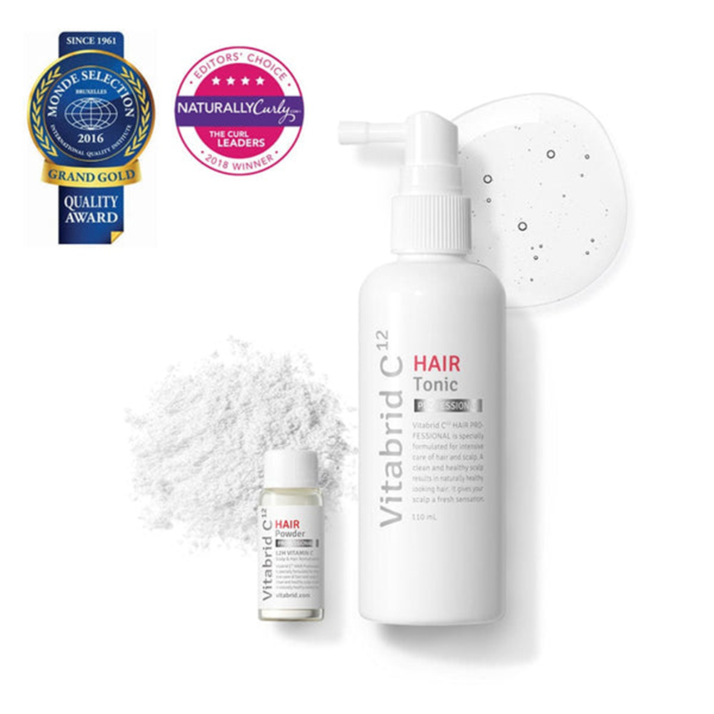 A bottle of Vitabrid C¹² HAIR Tonic Set: Professional and a bottle of white powder.