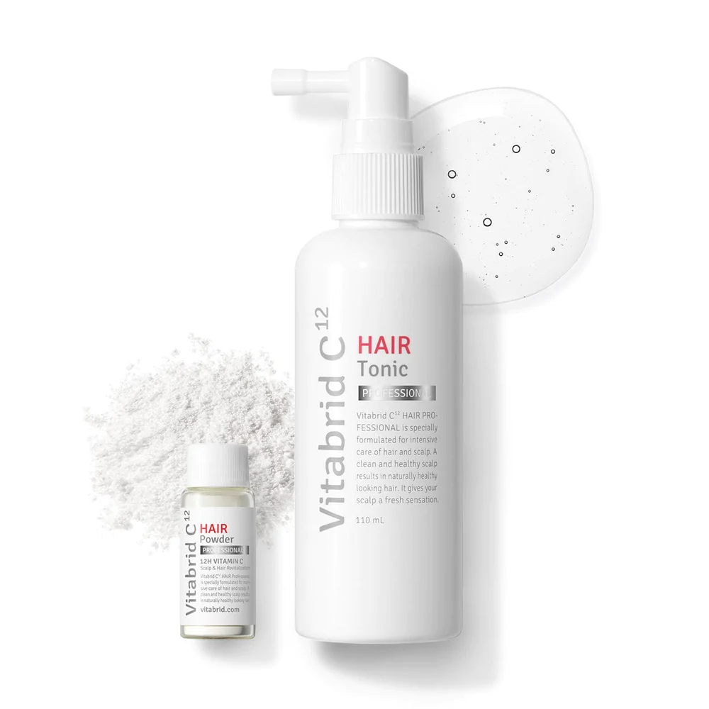 A bottle of Vitabrid C¹² HAIR Tonic Set: Professional and a bottle of powder on a white surface.