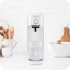 A novita SG Instant Hot Water Dispenser W18 - The Simplest with a glass of water next to it.