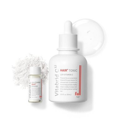 A bottle of Revive & Reignite Set: Vitabrid C¹² Scalp⁺ Shampoo + Vitabrid C¹² 12H Vitamin C Hair⁺ Set and a bottle of white powder.