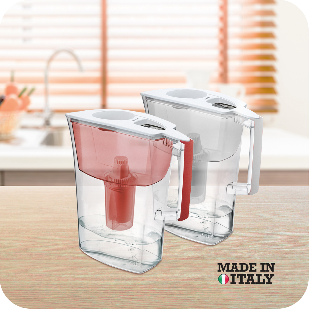 Two novita HydroPlus®/HydroPure™ Water Pitcher NP110s on a wooden table.