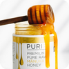 A high-end PURITI jar of pure raw manuka honey with a wooden stick, known for its exceptional purity. (Brand: novita SG)