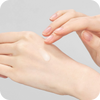 A woman's hand with Vitabrid C¹² Wrinkle Serum from Vitabrid on it.