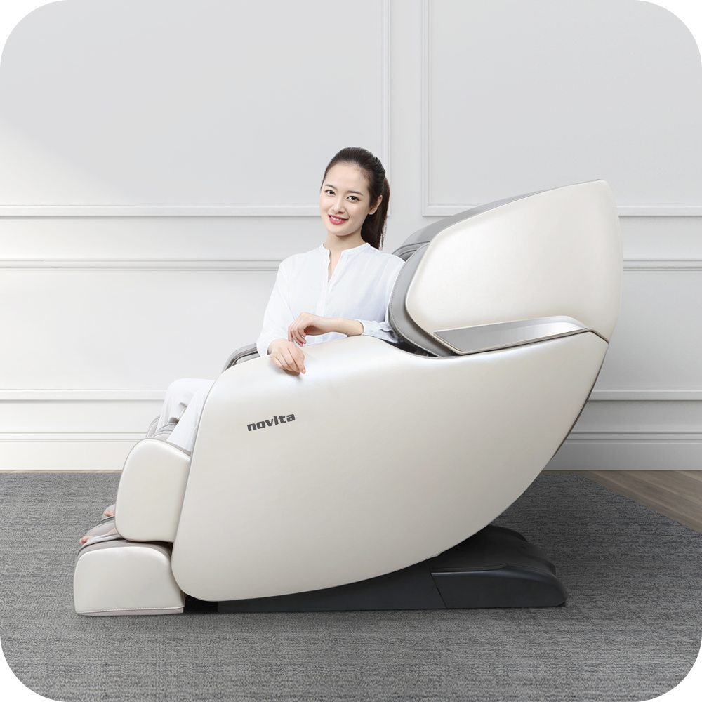 A woman sitting on a novita Massage Chair B11.