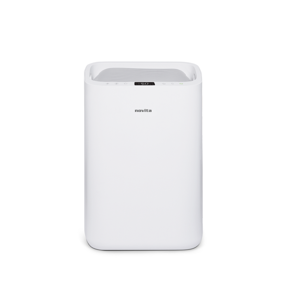 A white novita Dehumidifier + Air Purifier The 2-In-1 ND25.5 Product Warranty Extension with a basket of towels.