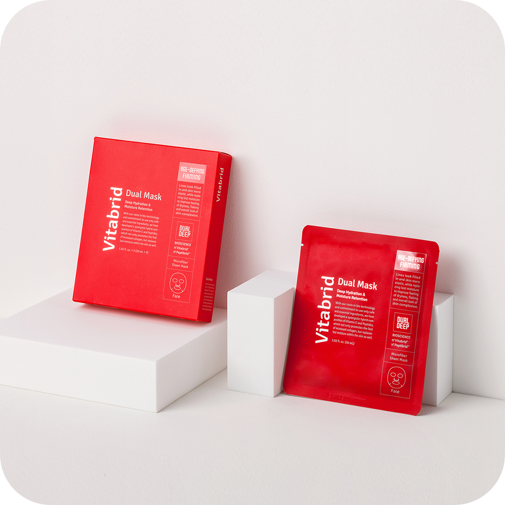 A red Vitabrid box with a white Vitabrid box on top of it.