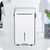 A white novita portable dehumidifier ND838 with 3 Years Full Warranty in a white room.