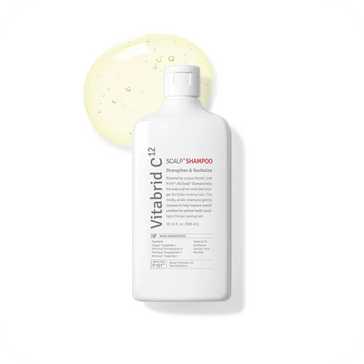 A bottle of Vitabrid C¹² Scalp<sup>+</sup> Shampoo on a white background.