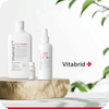 Vitabrid Restore & Regrowth Set: Vitabrid C¹² Scalp⁺ Shampoo + Vitabrid C¹² HAIR Tonic Set: Professional on a wooden table with a plant in the background.