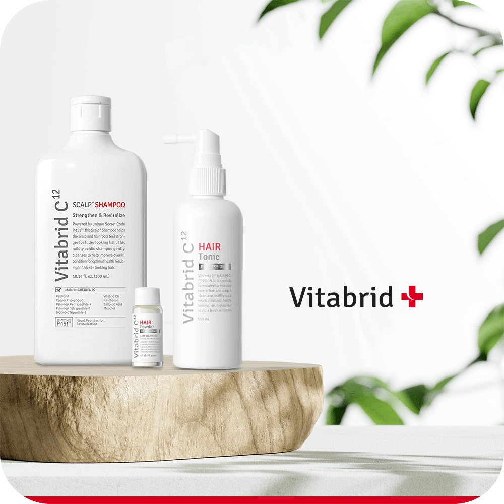 Vitabrid Restore & Regrowth Set: Vitabrid C¹² Scalp⁺ Shampoo + Vitabrid C¹² HAIR Tonic Set: Professional on a wooden table with a plant in the background.